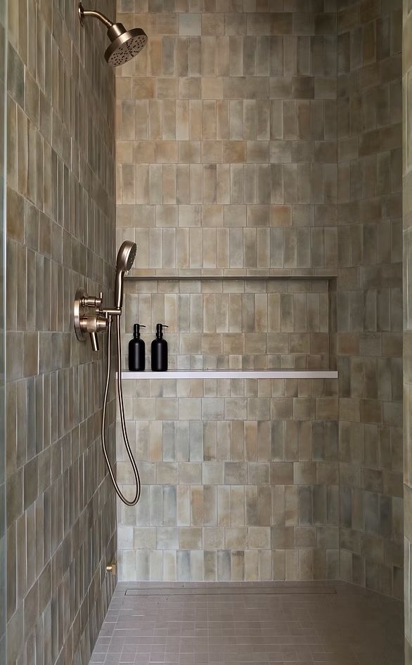 Walk-in shower in sage and sand handmade-look tile with a long niche and linear drain
